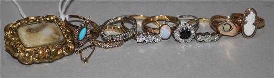 Nine assorted gold and gem set rings and a mourning brooch.